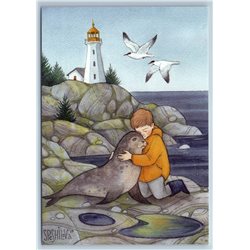 LITTLE BOY hug SEAL near Sea At Lighthouse Seaside Gull Bird Russian New Postcard